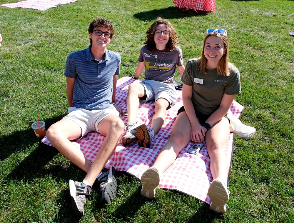 Admissions Tour guides sitting with prospective students