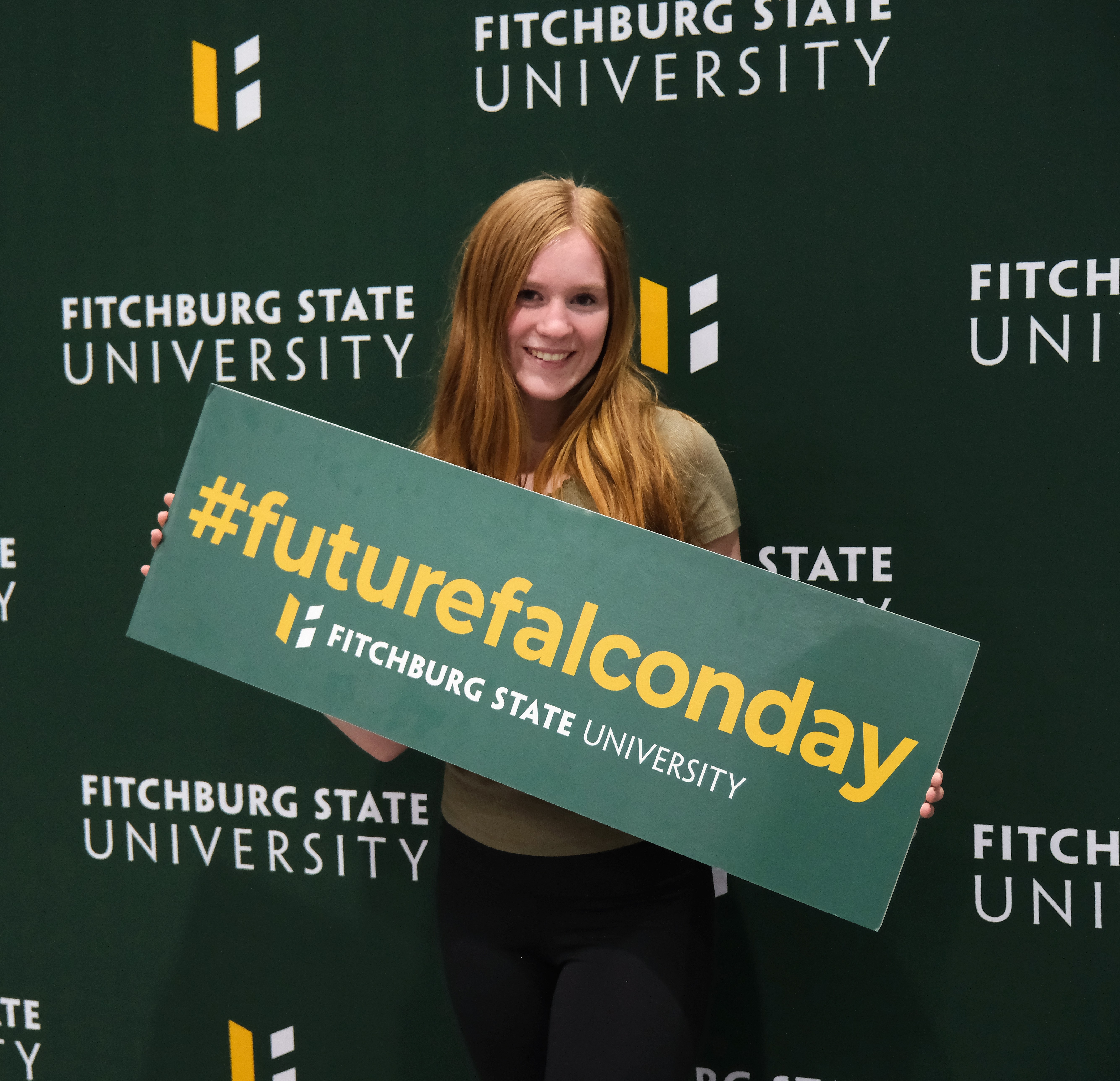 Accepted Student holding Future Falcon Day sign